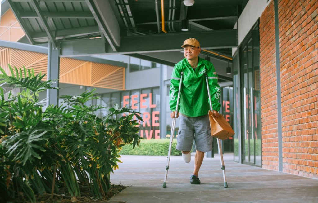 A man walking with a cane