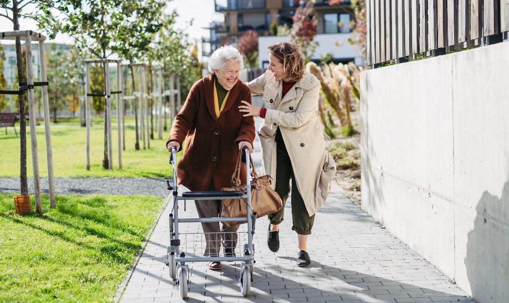 Grandmother,And,Mature,Granddaughter,On,A,Walk,In,City,Park,